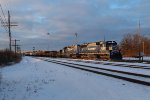 The morning sun shines on the 6355 & 6303 as the head north in to the yard